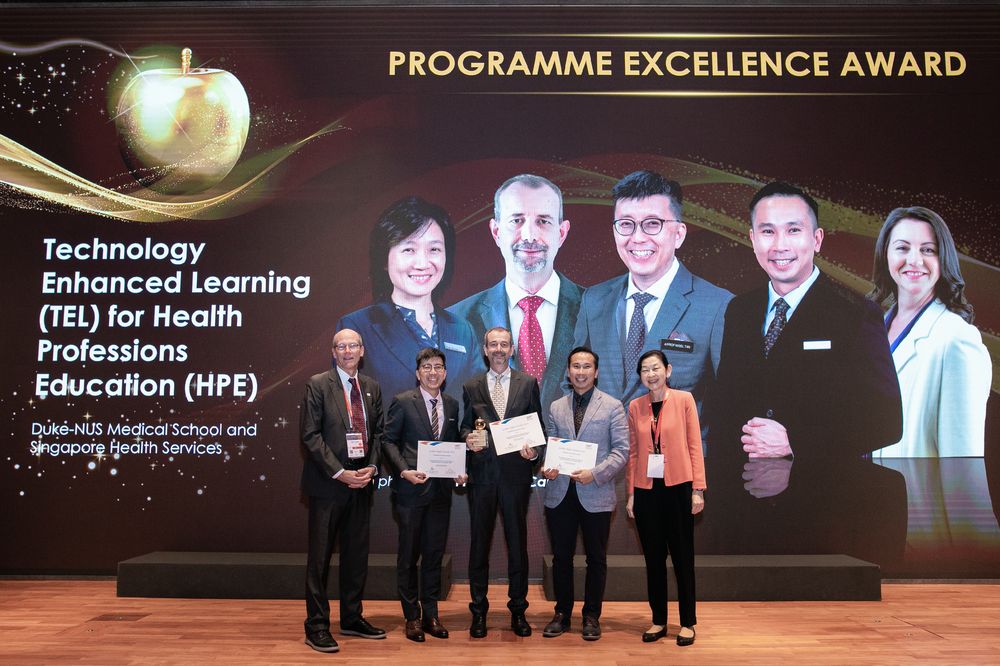 The team behind the Technology-Enhanced Learning for Health Professions Education course receive their Golden Apple Programme Excellence Award, credit - Academic Medicine Education Institute
