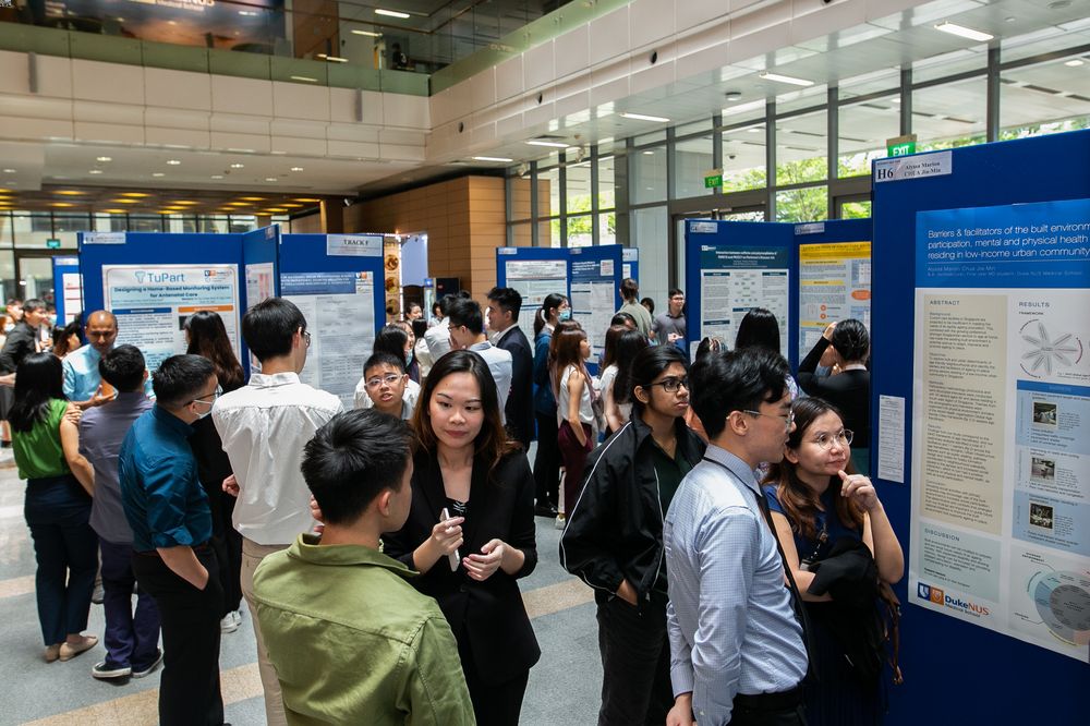 A bird&#39;s eye view of Duke-NUS medical students displaying and presenting their research posters in the Atrium of Duke-NUS Medical School