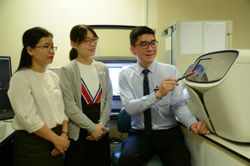 Dr Mary Nheb, Dr Chen Wanwan and Associate Professor Kenneth Chang in the pathology laboratory