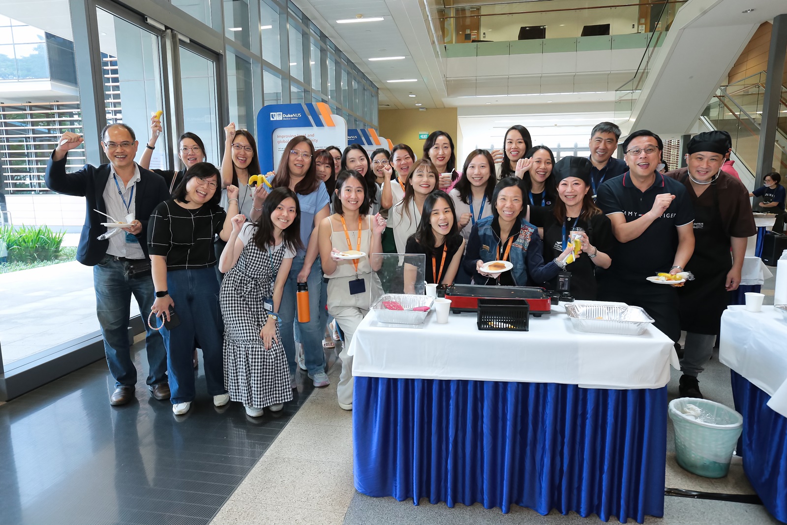 Ms Karen Chang poses with her team and colleagues, most of whom came to fervently support her pancake endeavours.