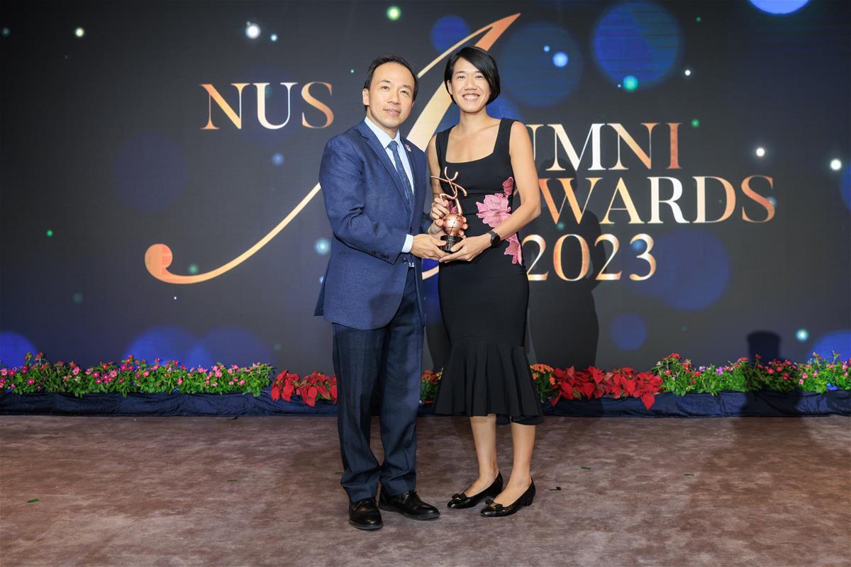 Assistant Professor Rena Dharmawan (Class of 2011) accepts her award from NUS Provost Professor Aaron Thean // Credit: NUS