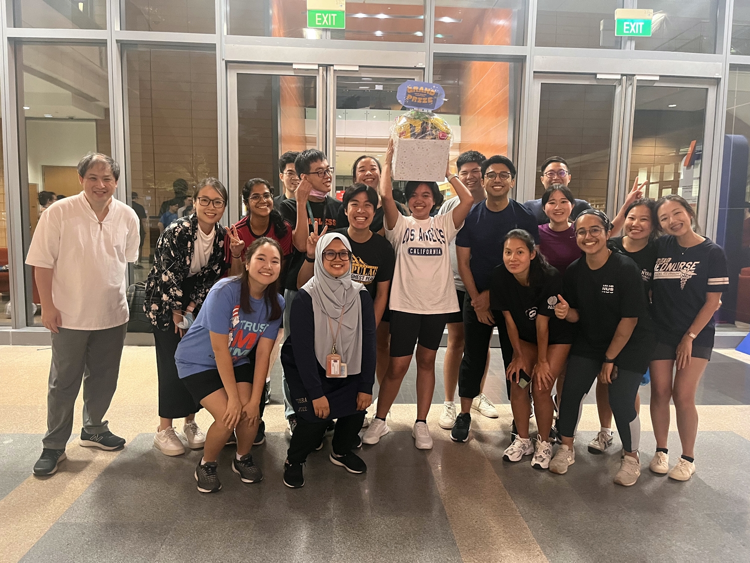 The InterCollege games grand prize winners pose for a group photo with Associate Dean Clinical Associate Professor Ng Yee Sien (left) // Credit: Courtesy of Muhammad Yusuf