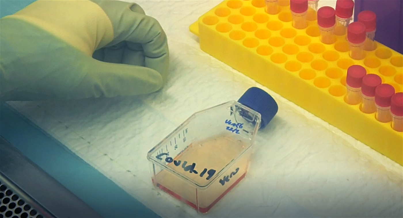 A member of the Duke-NUS team works in the BSL3 Lab on isolating the novel coronavirus